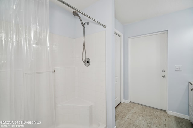 183 Frante Ave NE, Palm Bay, FL 32907 - full bath featuring wood finished floors, curtained shower, and vanity
