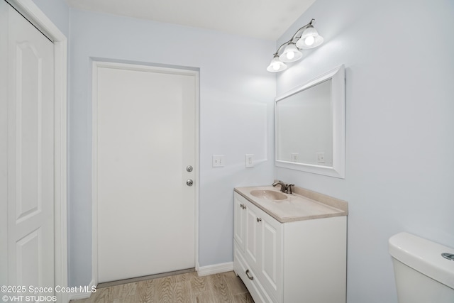 183 Frante Ave NE, Palm Bay, FL 32907 - half bathroom featuring vanity and wood finished floors