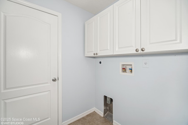 183 Frante Ave NE, Palm Bay, FL 32907 - laundry area featuring hookup for an electric dryer, cabinet space, hookup for a washing machine, and light tile patterned flooring