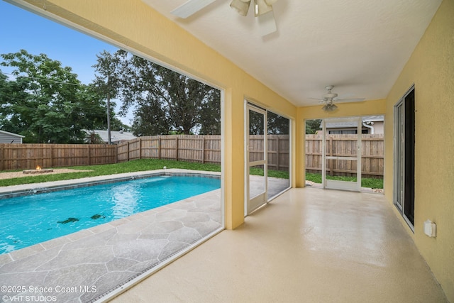183 Frante Ave NE, Palm Bay, FL 32907 - view of swimming pool featuring a ceiling fan, a patio area, and a fenced backyard