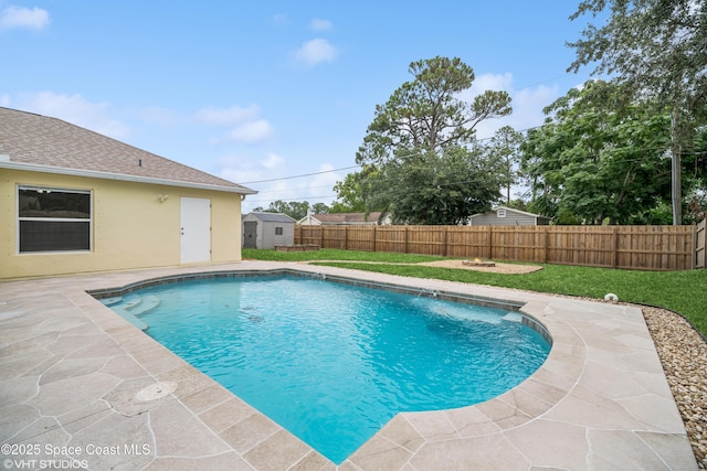 183 Frante Ave NE, Palm Bay, FL 32907 - view of pool with a fenced backyard, a storage unit, and a patio area