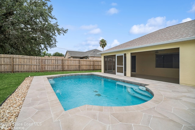 183 Frante Ave NE, Palm Bay, FL 32907 - view of swimming pool featuring a fenced backyard, a patio, and a sunroom