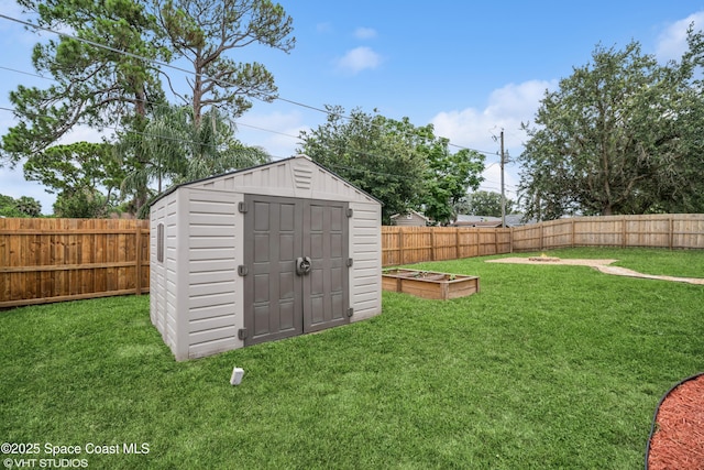 183 Frante Ave NE, Palm Bay, FL 32907 - view of shed with a garden and a fenced backyard