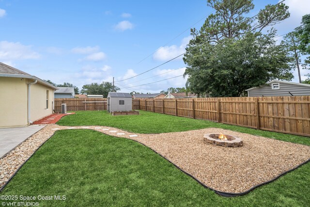183 Frante Ave NE, Palm Bay, FL 32907 - fenced backyard featuring a fire pit, a shed, and a patio