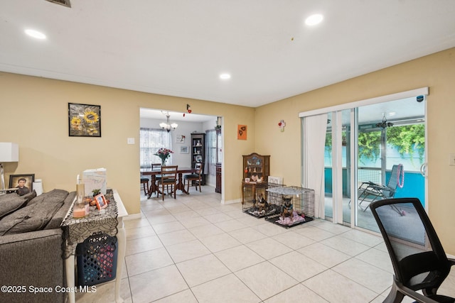 1565 Venus St, Merritt Island, FL 32953 - living area with plenty of natural light, light tile patterned floors, recessed lighting, and a chandelier