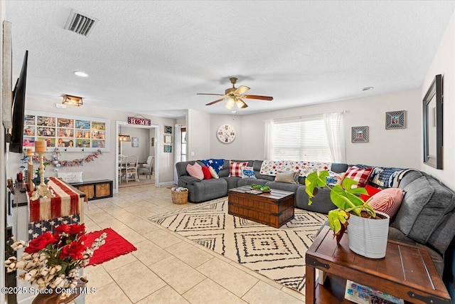 260 Utopia Cir, Merritt Island, FL 32952 - living room featuring ceiling fan, tile patterned floors, and a textured ceiling