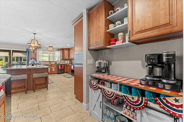 260 Utopia Cir, Merritt Island, FL 32952 - kitchen with stainless steel dishwasher, brown cabinetry, open shelves, a textured ceiling, and a chandelier