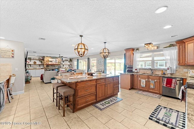 260 Utopia Cir, Merritt Island, FL 32952 - kitchen featuring dishwasher, a chandelier, brown cabinetry, plenty of natural light, and recessed lighting