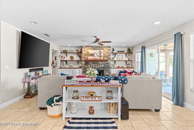 260 Utopia Cir, Merritt Island, FL 32952 - living room featuring a textured ceiling, light tile patterned floors, a ceiling fan, a fireplace, and recessed lighting