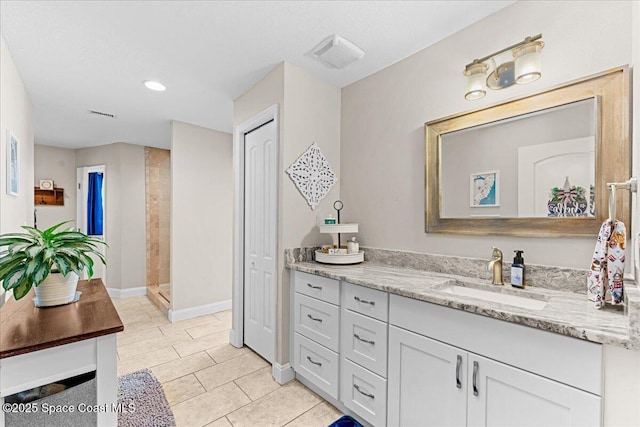260 Utopia Cir, Merritt Island, FL 32952 - full bathroom featuring vanity, a tile shower, tile patterned flooring, and recessed lighting