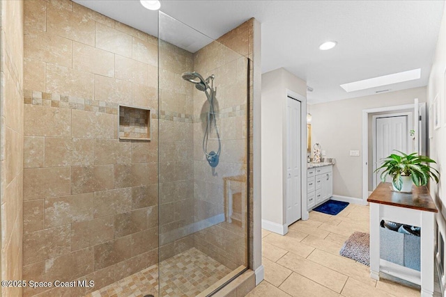 260 Utopia Cir, Merritt Island, FL 32952 - full bath featuring a tile shower, a skylight, vanity, tile patterned flooring, and recessed lighting