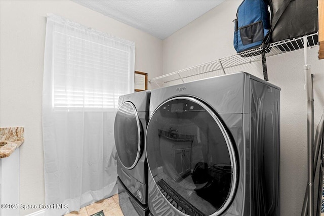 260 Utopia Cir, Merritt Island, FL 32952 - laundry area with washing machine and clothes dryer and light tile patterned floors