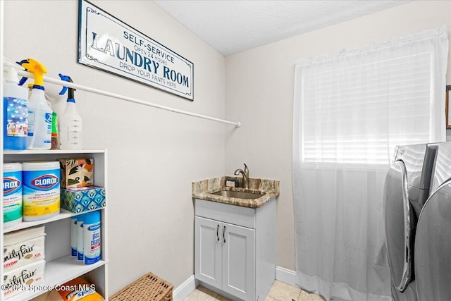 260 Utopia Cir, Merritt Island, FL 32952 - washroom featuring independent washer and dryer, cabinet space, a textured ceiling, and light tile patterned floors