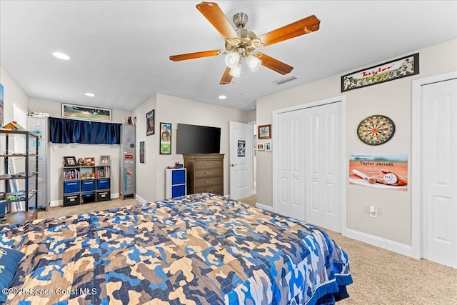 260 Utopia Cir, Merritt Island, FL 32952 - bedroom featuring multiple closets, carpet floors, recessed lighting, and a ceiling fan