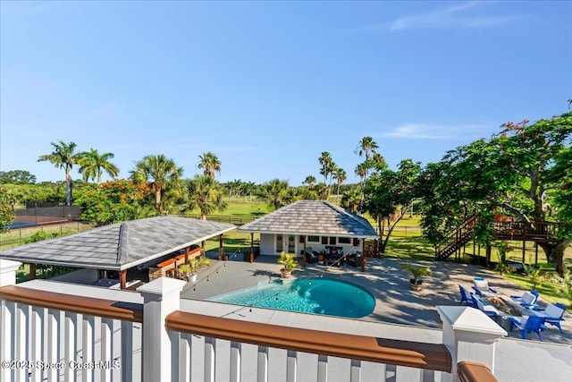 260 Utopia Cir, Merritt Island, FL 32952 - swimming pool with a storage structure, an outdoor structure, and a patio