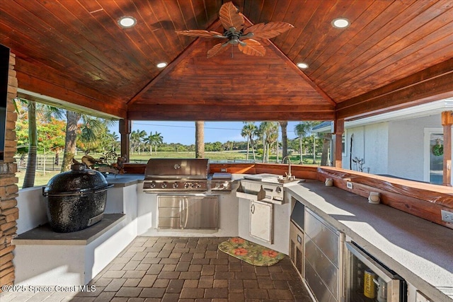 260 Utopia Cir, Merritt Island, FL 32952 - view of patio featuring a gazebo, ceiling fan, exterior kitchen, and beverage cooler