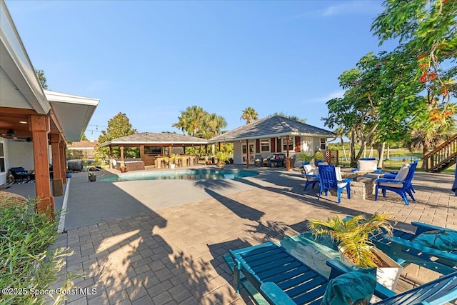 260 Utopia Cir, Merritt Island, FL 32952 - view of swimming pool featuring a patio, a gazebo, an outdoor structure, and an outdoor fire pit