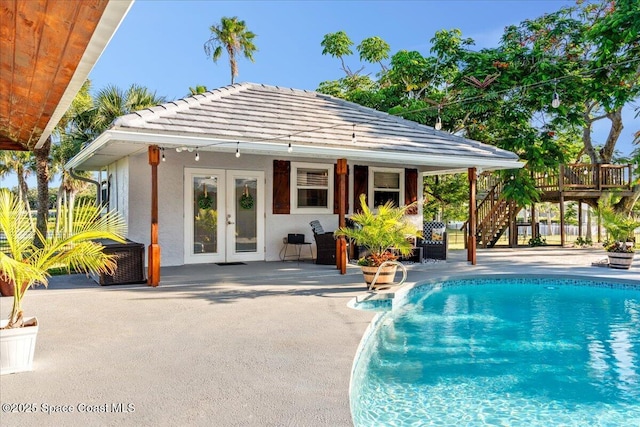 260 Utopia Cir, Merritt Island, FL 32952 - swimming pool featuring french doors, stairs, a patio, and a deck