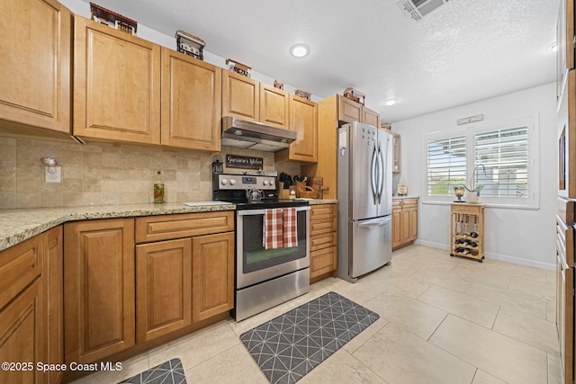 743 Palm Springs Cir, Satellite Beach, FL 32937 - kitchen featuring appliances with stainless steel finishes, under cabinet range hood, decorative backsplash, light stone counters, and recessed lighting