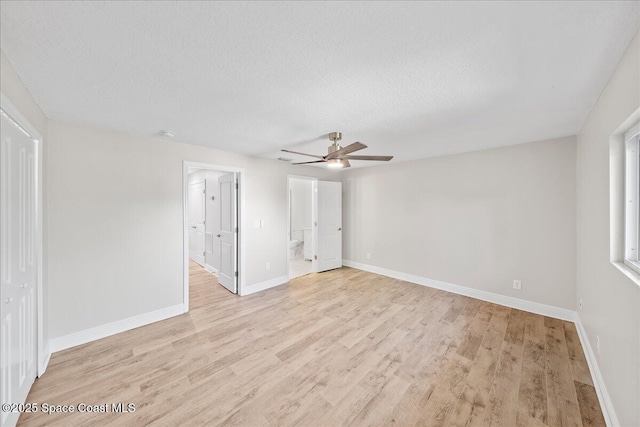 203 6th Ave Unit 9, Melbourne Beach, FL 32951 - empty room featuring ceiling fan, light wood-type flooring, and a textured ceiling