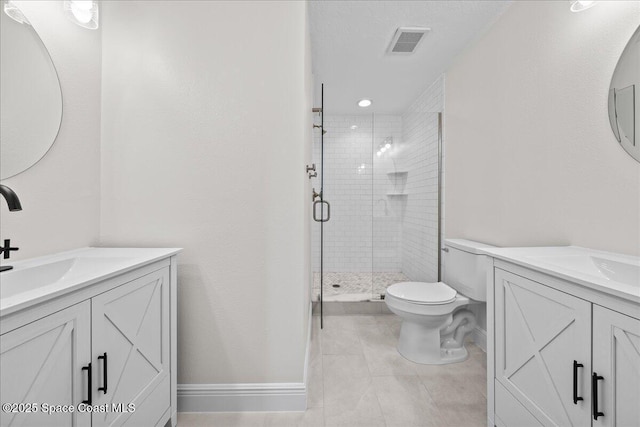 203 6th Ave Unit 9, Melbourne Beach, FL 32951 - bathroom with a stall shower, two vanities, and tile patterned flooring