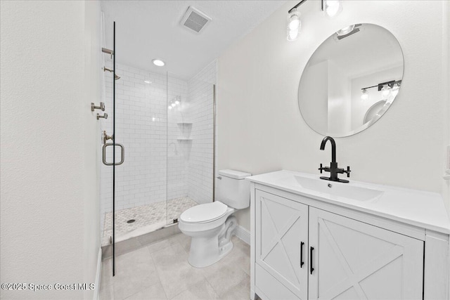 203 6th Ave Unit 9, Melbourne Beach, FL 32951 - bathroom featuring vanity, a stall shower, and tile patterned flooring