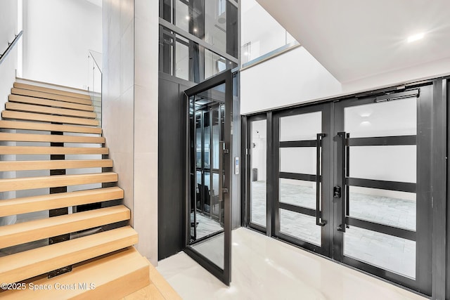 16 Seaside Ave, Key Largo, FL 33037 - staircase featuring french doors