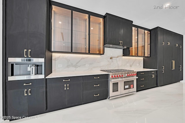 16 Seaside Ave, Key Largo, FL 33037 - kitchen featuring double oven range, dark cabinetry, backsplash, and light countertops