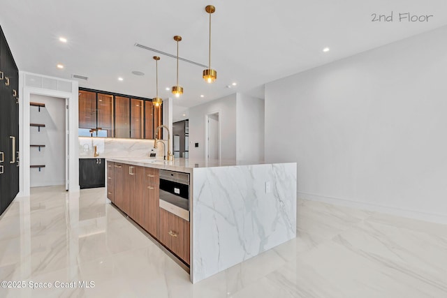 16 Seaside Ave, Key Largo, FL 33037 - kitchen with modern cabinets, a large island with sink, light marble finish floors, light stone counters, and recessed lighting