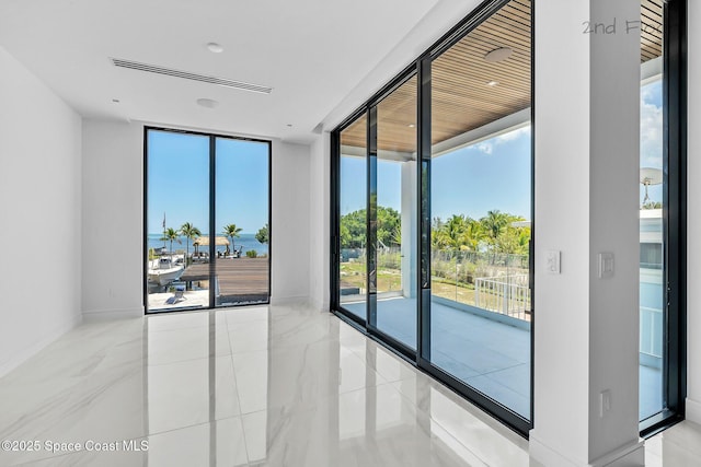 16 Seaside Ave, Key Largo, FL 33037 - unfurnished room featuring expansive windows
