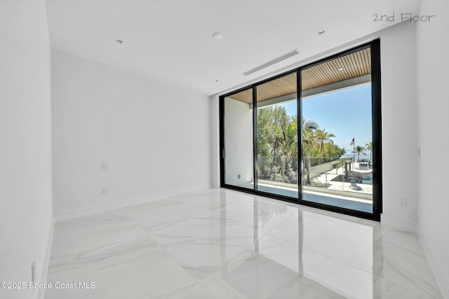 16 Seaside Ave, Key Largo, FL 33037 - unfurnished room featuring marble tiled flooring