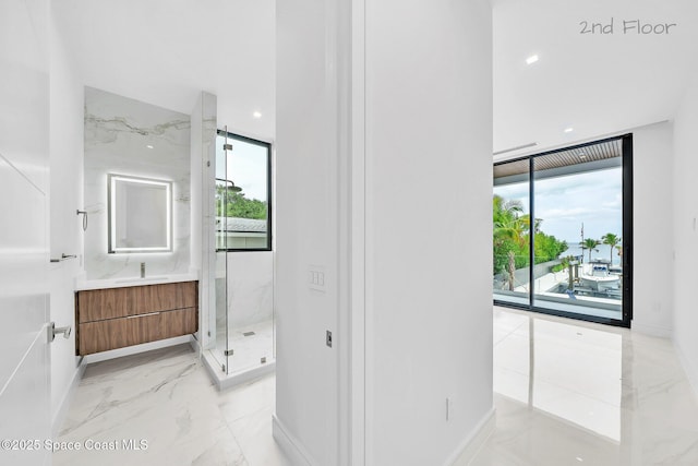 16 Seaside Ave, Key Largo, FL 33037 - bathroom featuring vanity, marble finish floors, and a marble finish shower