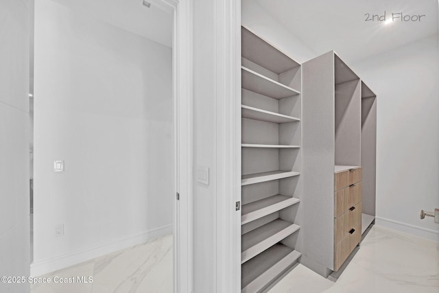 16 Seaside Ave, Key Largo, FL 33037 - walk in closet with light marble finish floors