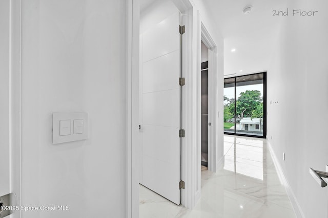 16 Seaside Ave, Key Largo, FL 33037 - corridor with light marble finish floors and baseboards