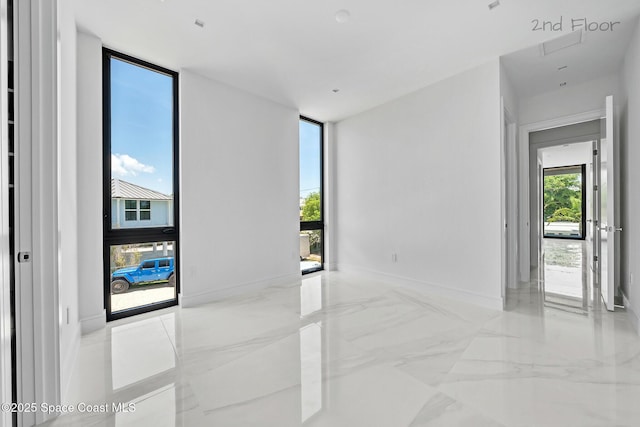 16 Seaside Ave, Key Largo, FL 33037 - spare room with marble tiled flooring