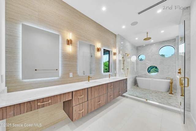 16 Seaside Ave, Key Largo, FL 33037 - full bathroom featuring a freestanding bath, double vanity, a stall shower, recessed lighting, and tile patterned floors