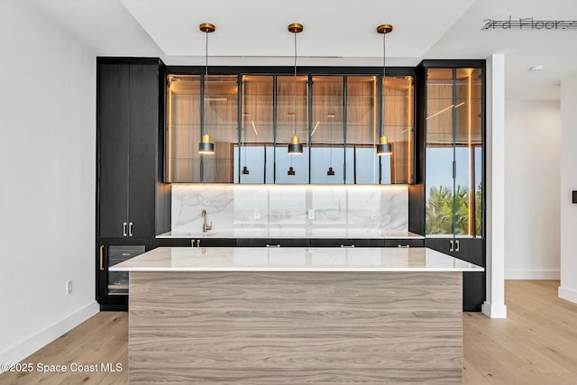 16 Seaside Ave, Key Largo, FL 33037 - indoor wet bar with light wood finished floors and decorative light fixtures