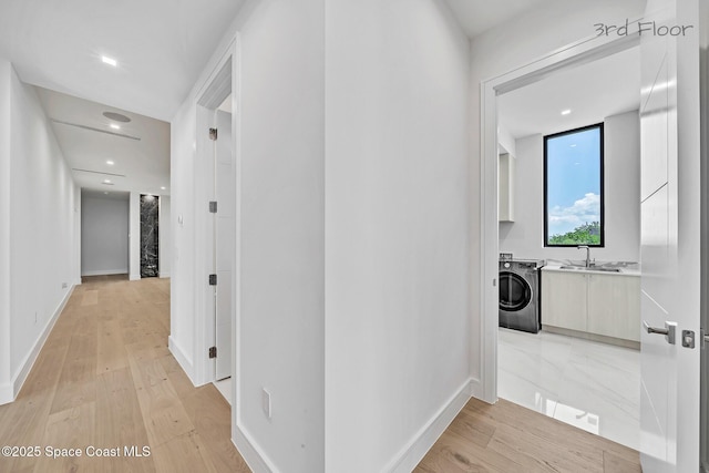16 Seaside Ave, Key Largo, FL 33037 - hall featuring washer / dryer, light wood-type flooring, and recessed lighting
