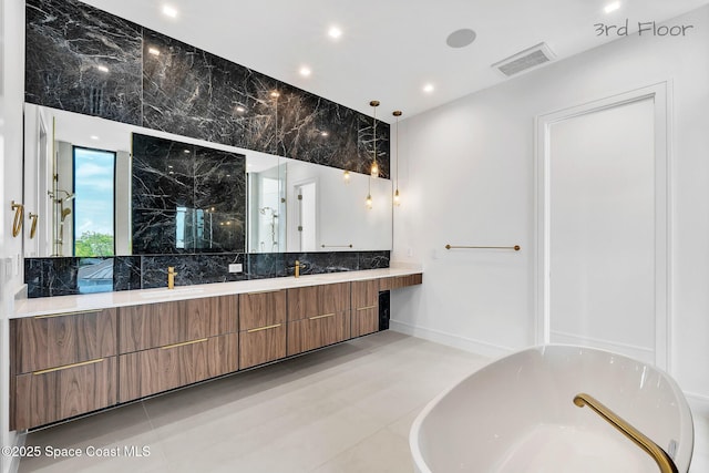 16 Seaside Ave, Key Largo, FL 33037 - bathroom with a freestanding bath, vanity, decorative backsplash, a marble finish shower, and recessed lighting