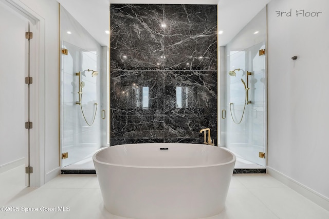 16 Seaside Ave, Key Largo, FL 33037 - bathroom featuring a marble finish shower, a freestanding bath, tile patterned floors, and recessed lighting
