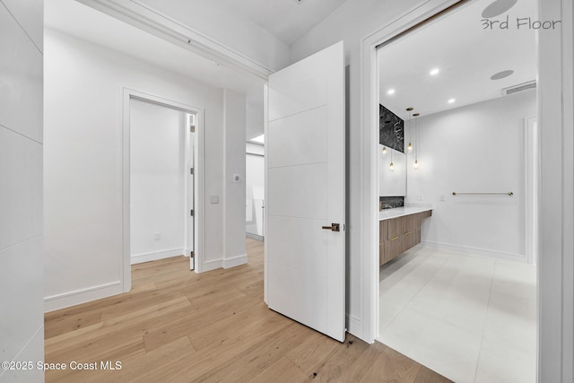 16 Seaside Ave, Key Largo, FL 33037 - hall featuring light wood-type flooring and recessed lighting