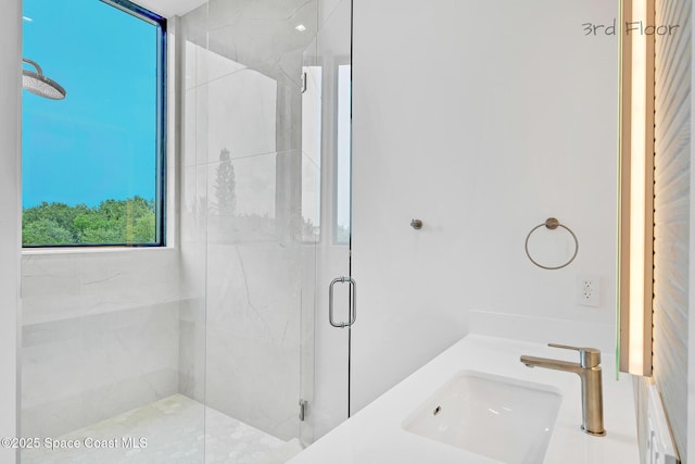 16 Seaside Ave, Key Largo, FL 33037 - full bathroom featuring a sink and a marble finish shower