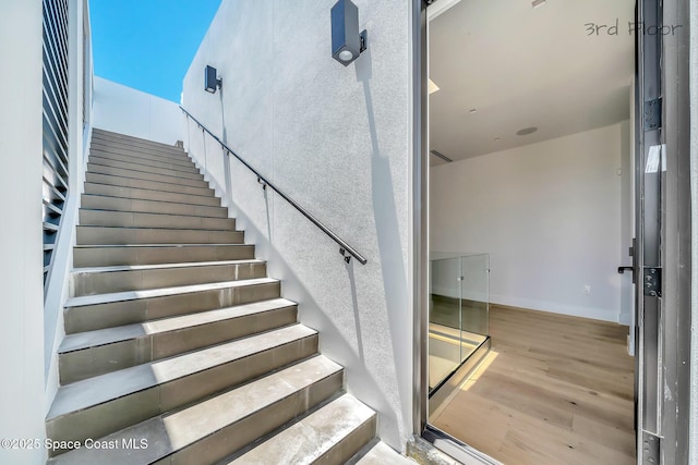 16 Seaside Ave, Key Largo, FL 33037 - stairs with wood finished floors and baseboards