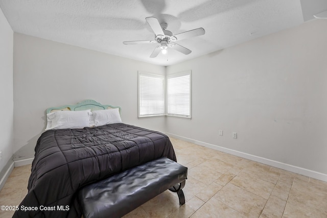 581 Jupiter Blvd NW, Palm Bay, FL 32907 - bedroom featuring a ceiling fan, light tile patterned floors, and a textured ceiling