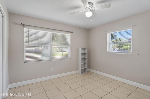 959 Macco Rd, Cocoa, FL 32927 - unfurnished room featuring a ceiling fan, light tile patterned flooring, and a textured ceiling