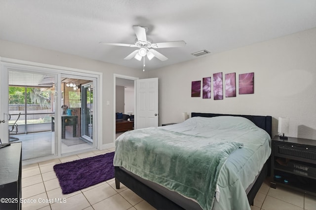 959 Macco Rd, Cocoa, FL 32927 - tiled bedroom with access to outside and a ceiling fan