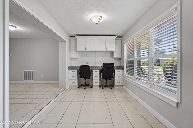 959 Macco Rd, Cocoa, FL 32927 - office with a textured ceiling, built in study area, and light tile patterned flooring