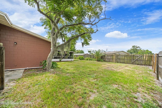 959 Macco Rd, Cocoa, FL 32927 - fenced backyard with a sunroom