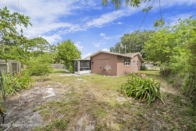 959 Macco Rd, Cocoa, FL 32927 - fenced backyard with a sunroom