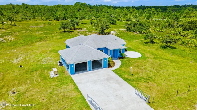 156 Puddle Duck Ln, Grant-Valkaria, FL 32909 - aerial view of property and surrounding area featuring a forest